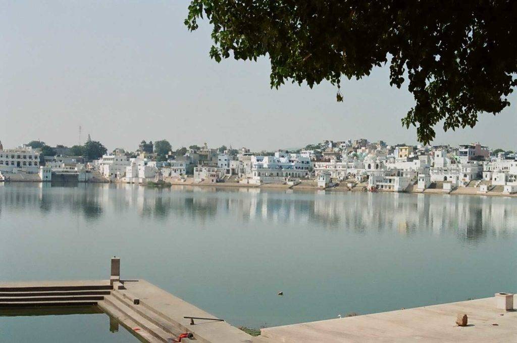 Pushkar lake surrounded by white buildings