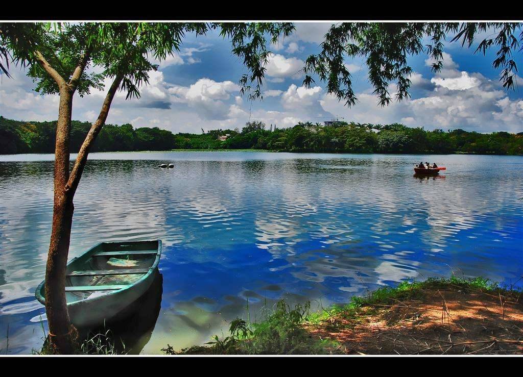 Boating and blue sky on the beautiful Karanji Lake at Mysore