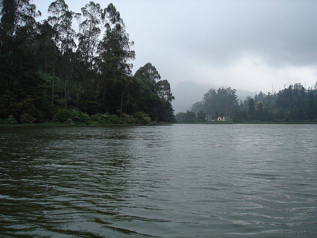 Evening mists on Ooty Lake under a cloudy sky