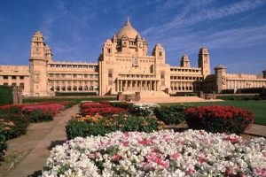 Building of Umaid Bhawan Palace Museum and surrounding gardens under clear blue sky