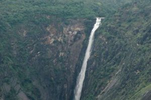 Amidst the green hills white waters of Thalaiyar Falls coming down from a great height