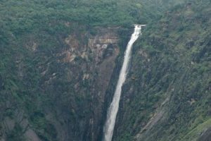 Amidst the green hills white waters of Thalaiyar Falls coming down from a great height