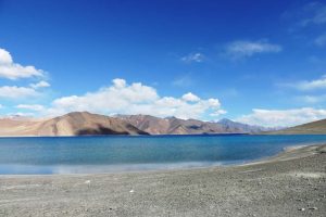Blue waters of Pangong Lake under a clear sky